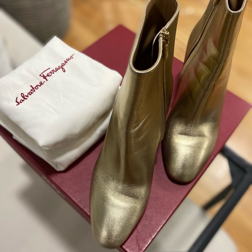 Salvatore Ferragamo Gold Mettalic Flower ankle boots.